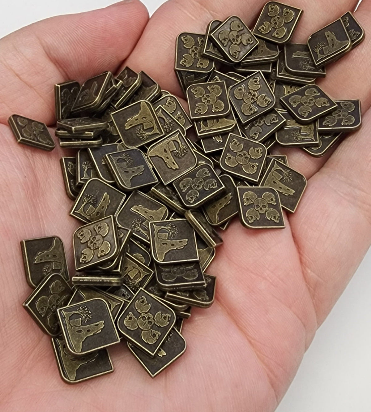 Electrum metal RPG coins arranged for tabletop play
